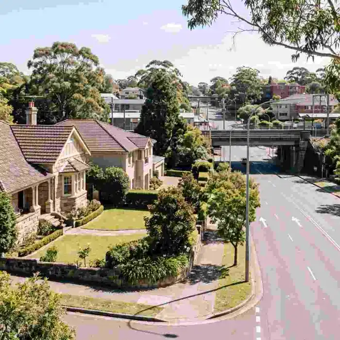 A Gordon family home with the rail bridge and village centre behind