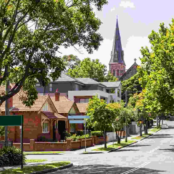 Willoughby street with a heritage church spire and period homes